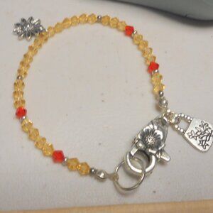 handmade bracelet, dainty, about 16 1/2" long, large heavy lobster claw clasp